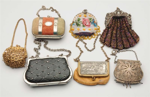 LOT OF 7: DOLL COIN PURSES.                       