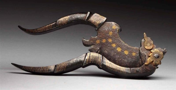EARLY DECORATED STEEL NUT CUTTER.                 