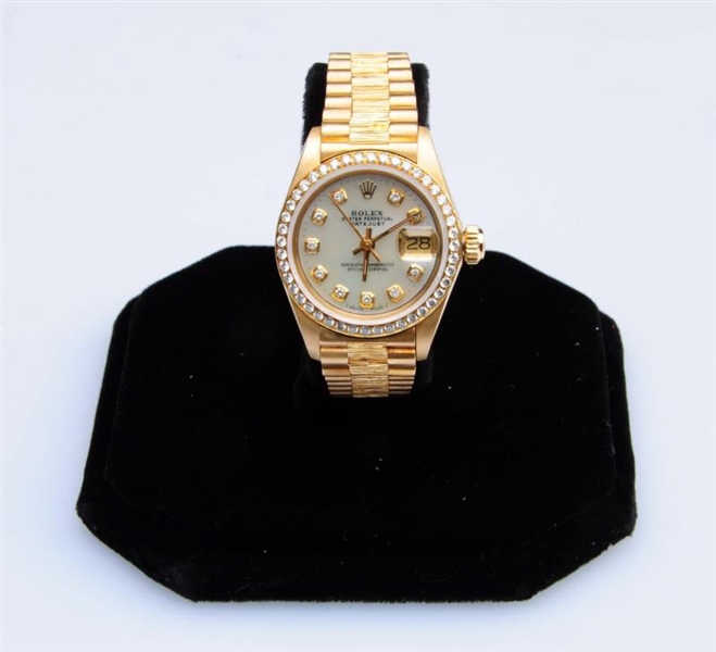 A LADYS DIAMOND AND 18KT GOLD WATCH, ROLEX       