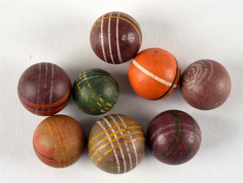 LOT OF 8: HAND PAINTED LIMESTONE MARBLES.         