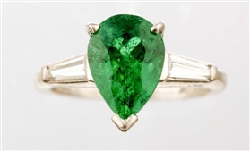 AN EMERALD AND DIAMOND RING.                      