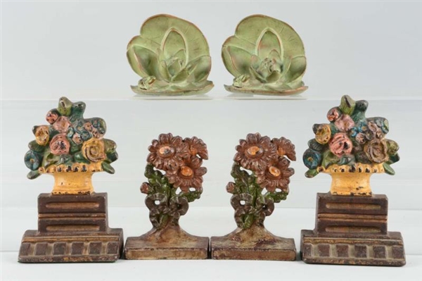 LOT OF 3 PAIRS: CAST IRON FLOWER BOOKENDS.        