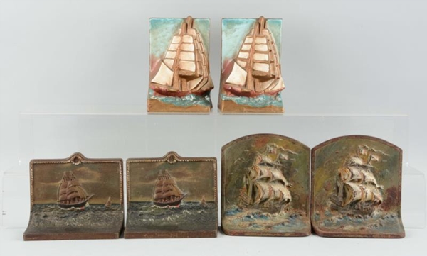 LOT OF 3 PAIRS: CAST IRON SHIP BOOKENDS.          