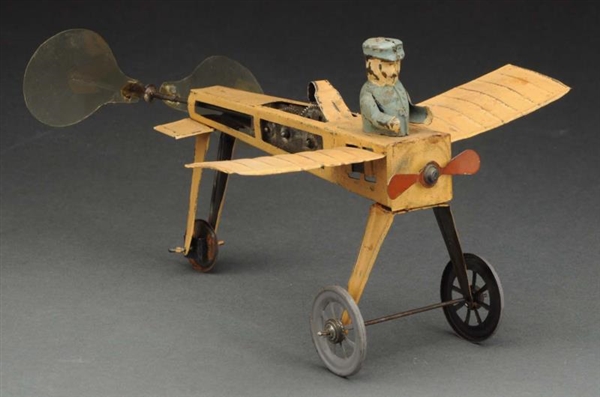 EARLY GERMAN TIN WIND UP SINGLE WING AIRPLANE TOY.