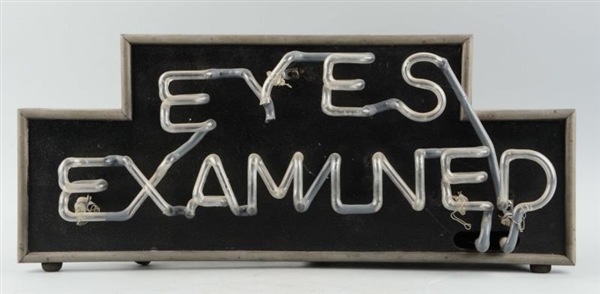 "EYES EXAMINED" NEON SIGN.                        