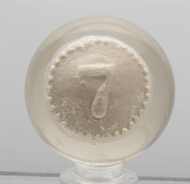 NUMERAL SEVEN ON A DISC SULPHIDE MARBLE.          
