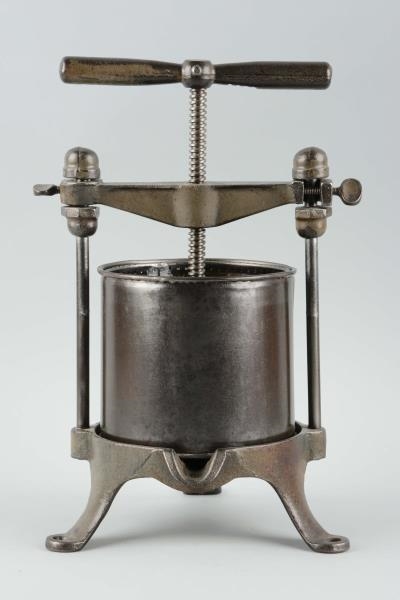 EARLY CAST IRON FRUIT PRESS.                      