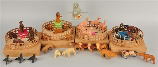 CIRCUS SET WITH FOUR RINGS CONTAINING ANIMALS.    