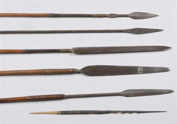 LOT OF 5: UNKNOWN SPEARS ON WOOD SHAFTS.          