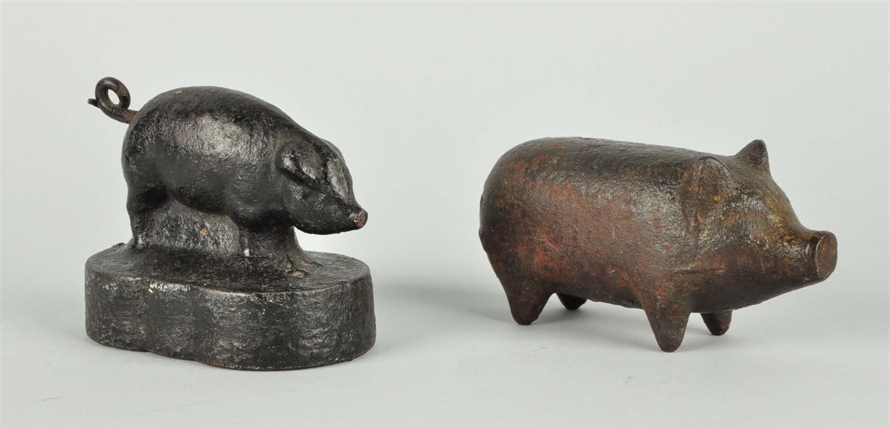 LOT OF 2: CAST IRON PIG PAPERWEIGHTS.
