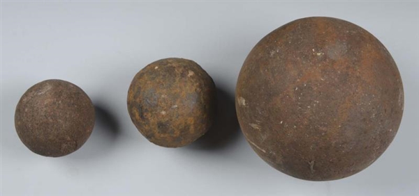 LOT OF 3: EXCAVATED SOLID SHOT CANNON BALLS.      