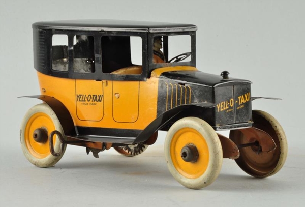 STRAUSS TIN LITHO WIND-UP YELLOW TAXI TOY.        