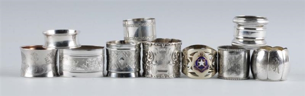 LOT OF 10: INTRICATE SILVER NAPKIN RINGS.         