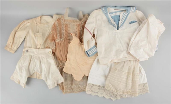 LOT OF 10:   ANTIQUE DOLL CLOTHING.               