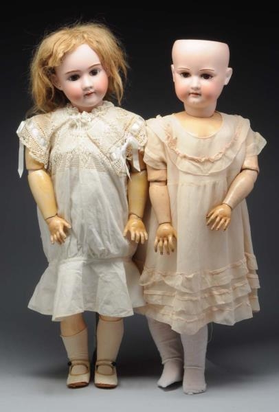 LOT OF 2: LARGE GERMAN BISQUE HEAD DOLLS.         