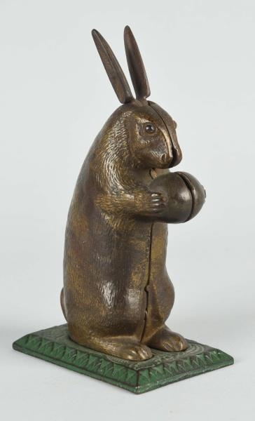 RABBIT WITH MOVABLE EARS MECHANICAL BANK.         