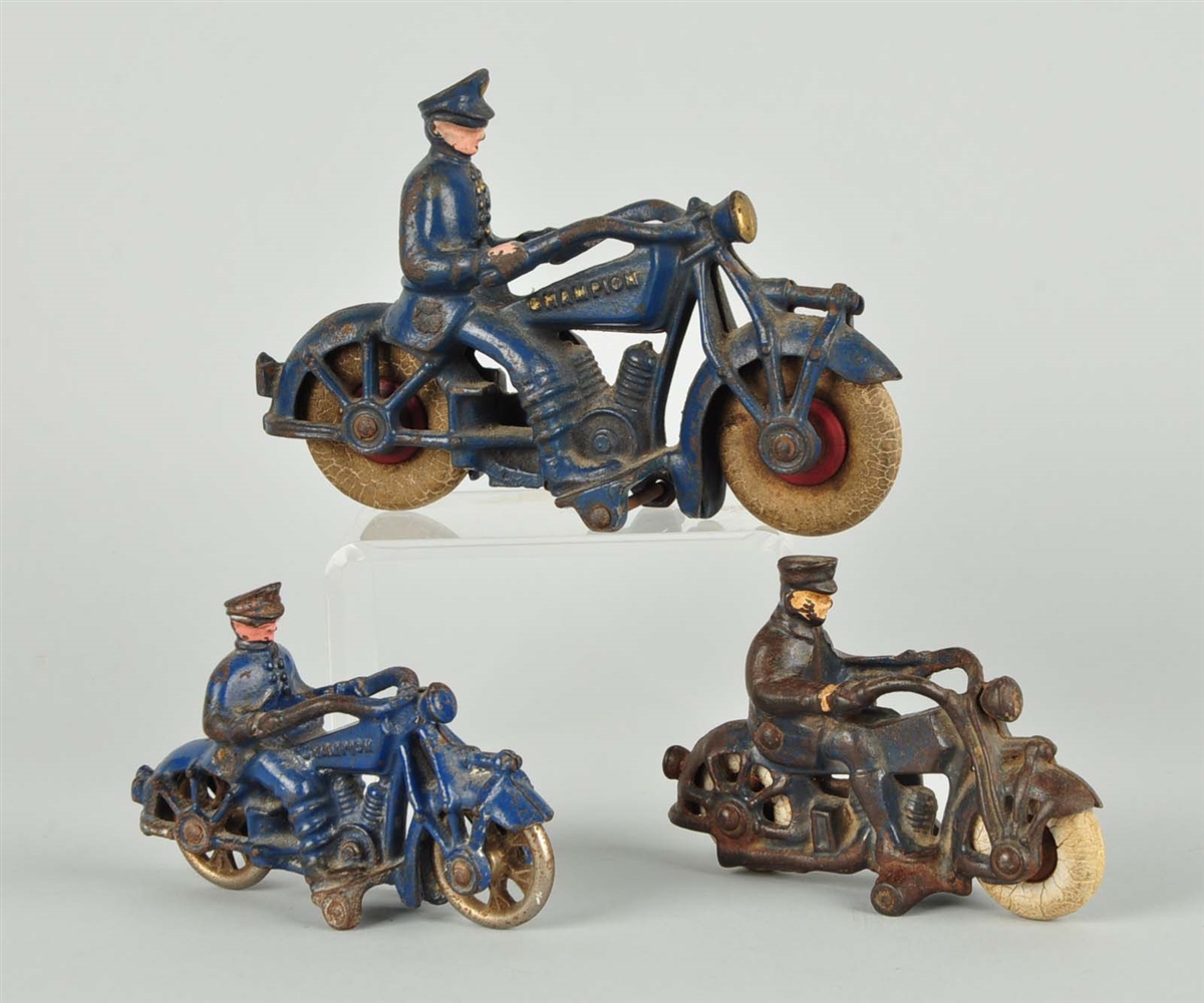 LOT OF 3: CAST IRON MOTORCYCLISTS.