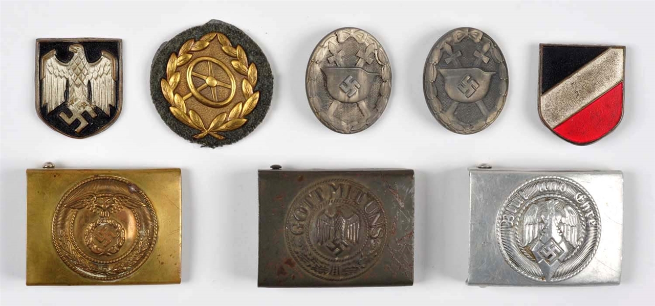 LOT OF 8: NAZI METALS AND BUCKLES.                