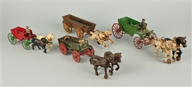 LOT OF 4: CAST IRON HORSE DRAWN WAGONS.