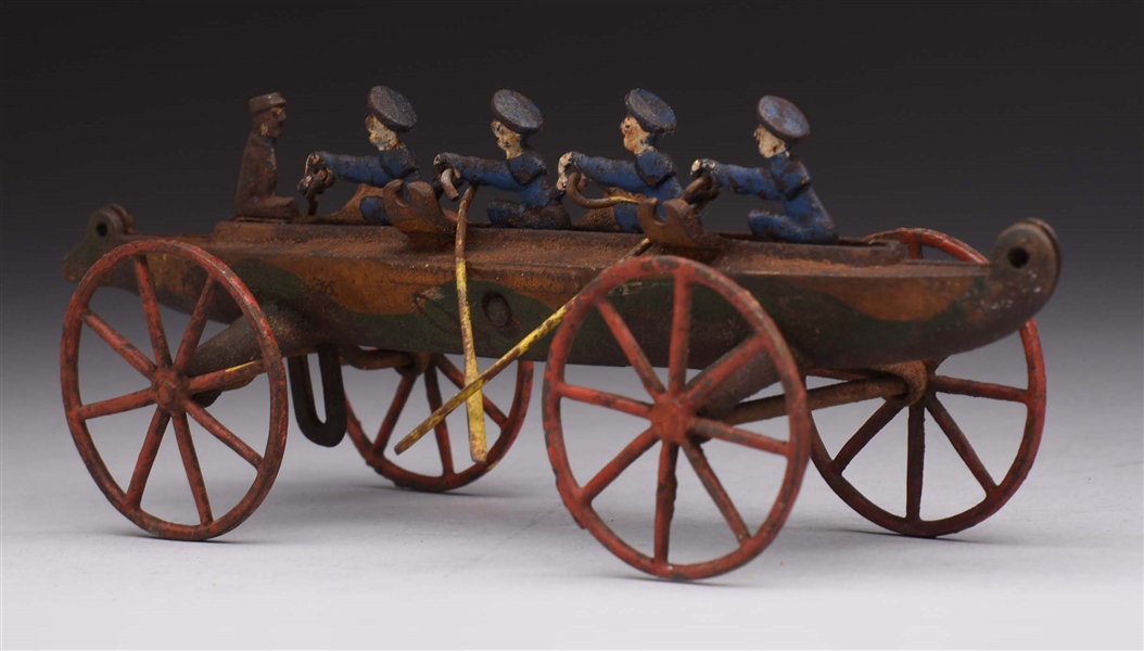 CAST IRON ROWING BOAT.