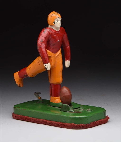 CAST IRON FOOTBALL PLAYER TOY.