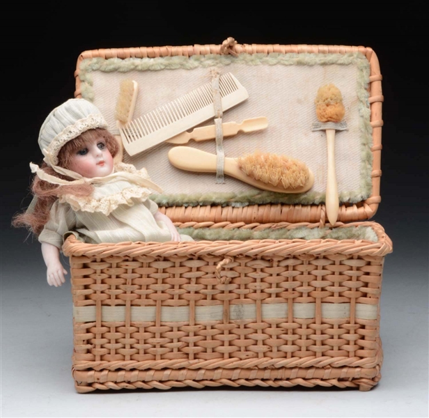 ALL-BISQUE DOLL IN WICKER TRUNK.                  