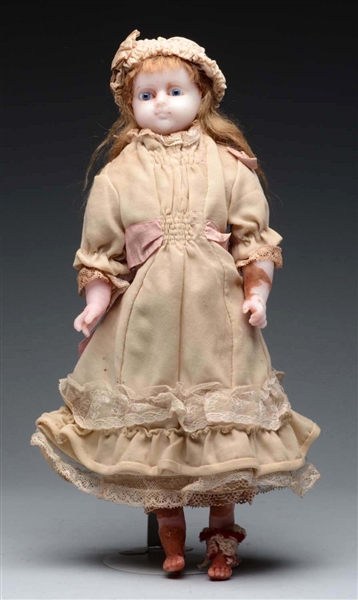 ENGLISH POURED WAX CHILD DOLL.                    