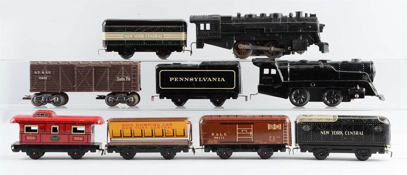 LOT OF 9: MARX STEAM LOCOMOTIVES & FREIGHT CARS.
