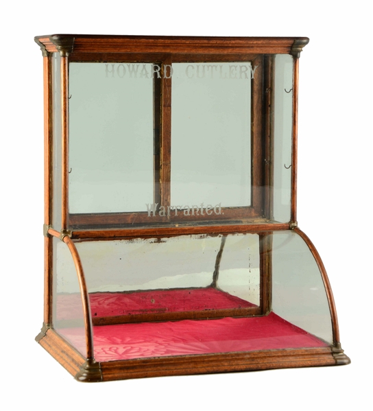HOWARD CUTLERY CURVED GLASS DISPLAY CASE.