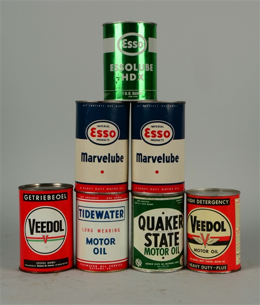 LOT OF 7: ONE QUART ROUND METAL MOTOR OIL CANS.
