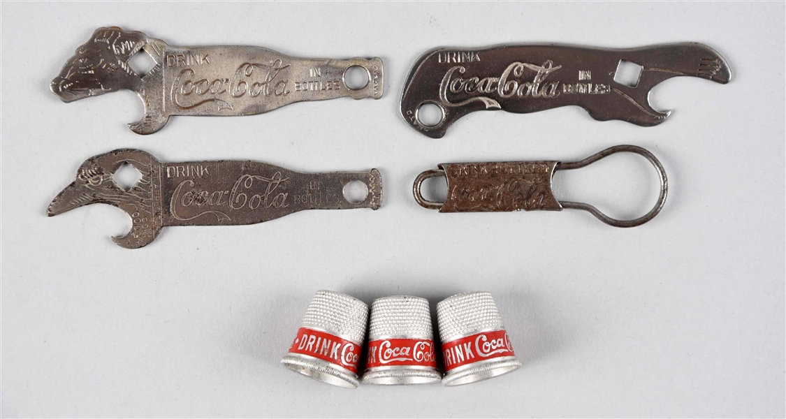 ASSORTED EARLY COCA - COLA BOTTLE OPENERS & THIMBLES.
