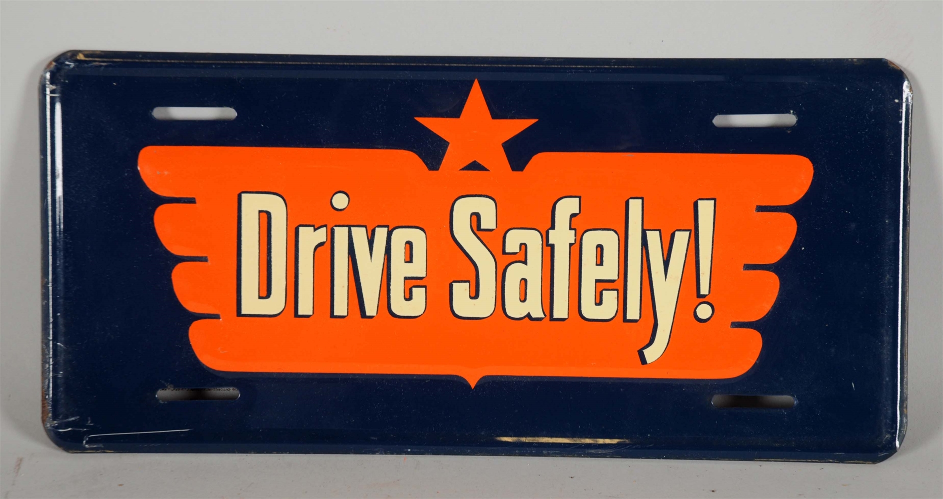 EMBOSSED DRIVE SAFELY TIN ADVERTISING PLATE. 