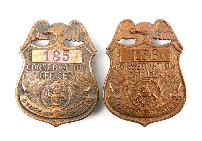 LOT OF 2: EARLY STATE OF MICHIGAN CONSERVATION OFFICER BADGES.