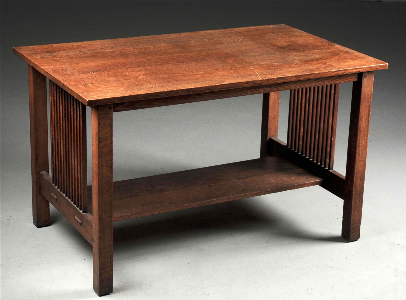 GUSTAV STICKLEY SPINDLE SIDED LIBRARY TABLE NO. 657.