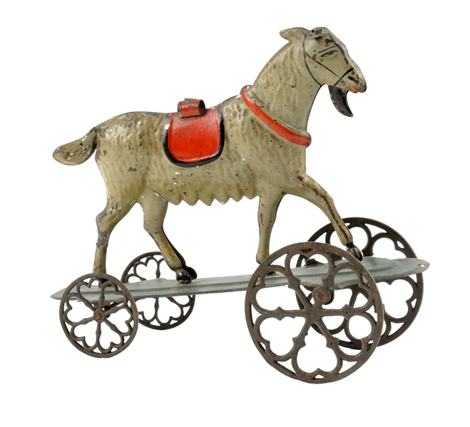 EARLY AMERICAN TIN HAND-PAINTED GOAT PLATFORM TOY.