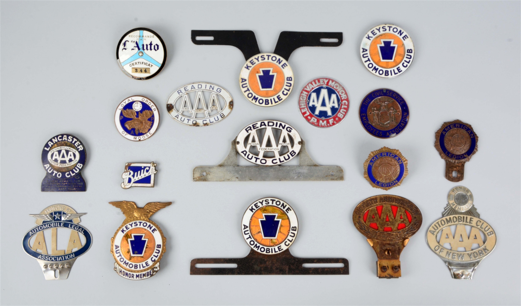 LOT OF 15: AAA AUTO CLUB RADIATOR BADGES & LICENSE PLATE ATTACHMENTS.