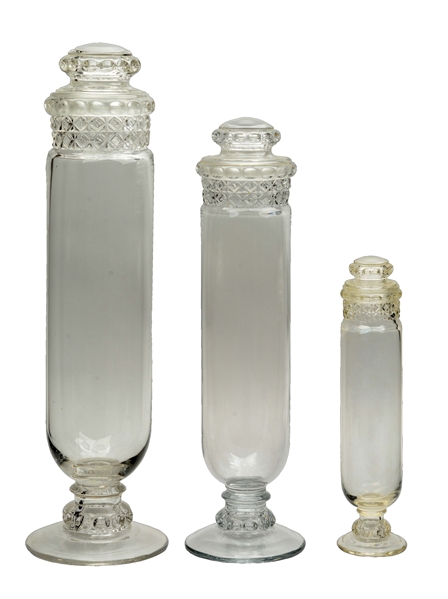 LOT OF 3: CLEAR GLASS DAKOTA TUBE CANDY JARS WITH LIDS.