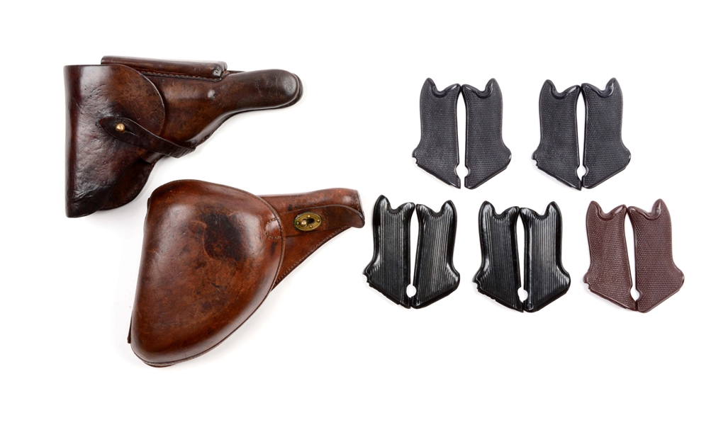 FIVE SETS OF LUGER GRIPS AND TWO HOLSTERS