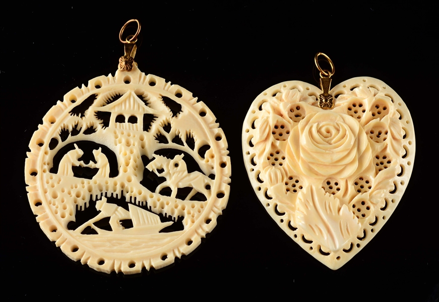 LOT OF 2: CARVED IVORY PENDANTS.