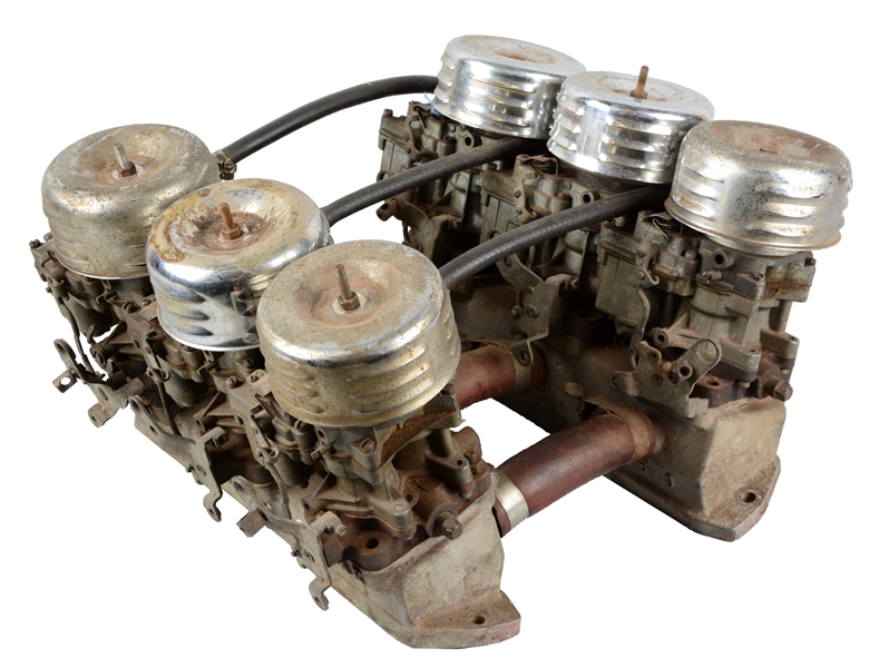 SMALL BLOCK CHEVROLET WEIAND INTAKE WITH SIX CARBS.