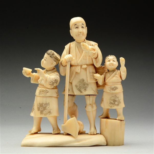 CARVED IVORY W/ THREE FIGURES.