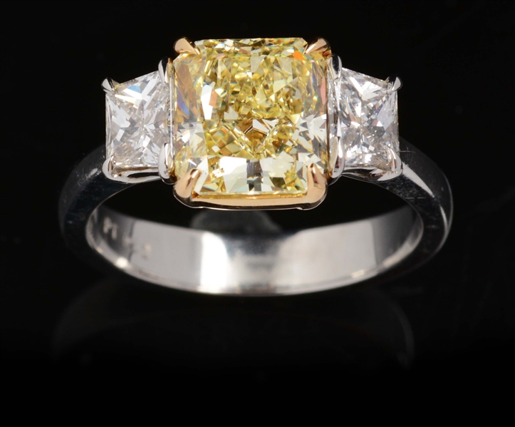 NATURAL FANCY YELLOW DIAMOND WEIGHING 2.77 CARATS SET IN PLATINUM DIAMOND RING.