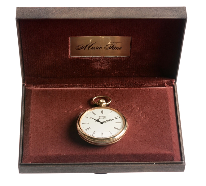 GRUEN MUSIC TIME POCKET WATCH IN BASE METAL WITH MUSIC BOX.