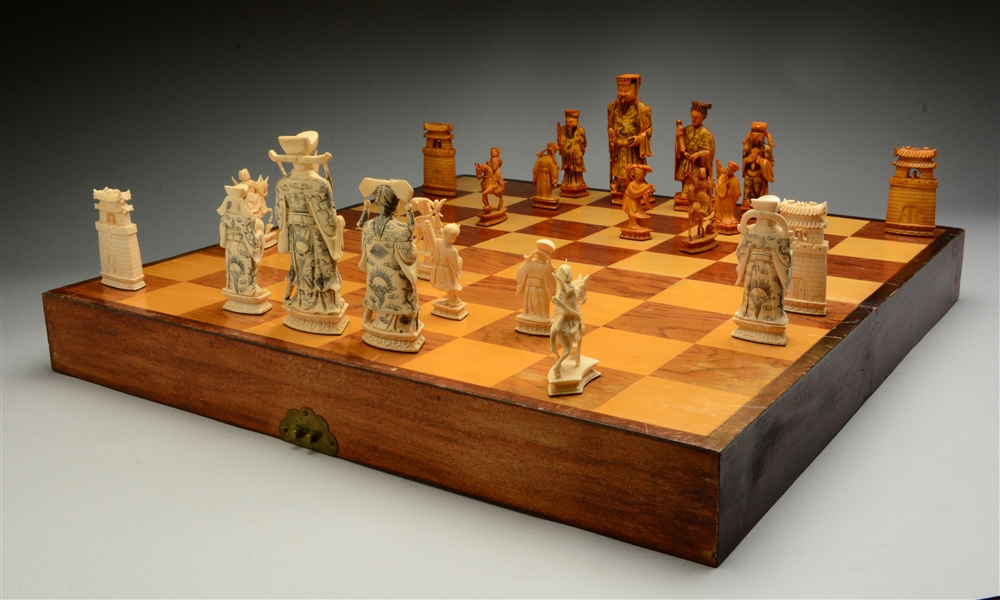 HAND CARVED IVORY CHESS SET.