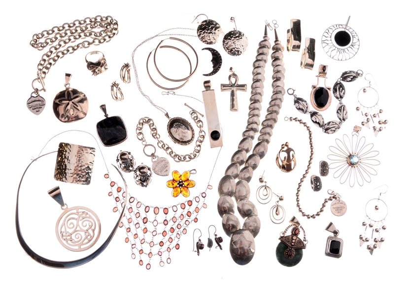LARGE ASSORTMENT OF SILVER JEWELRY.