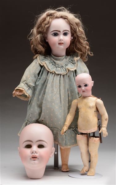 ASSORTED DOLL HEADS & PARTS.