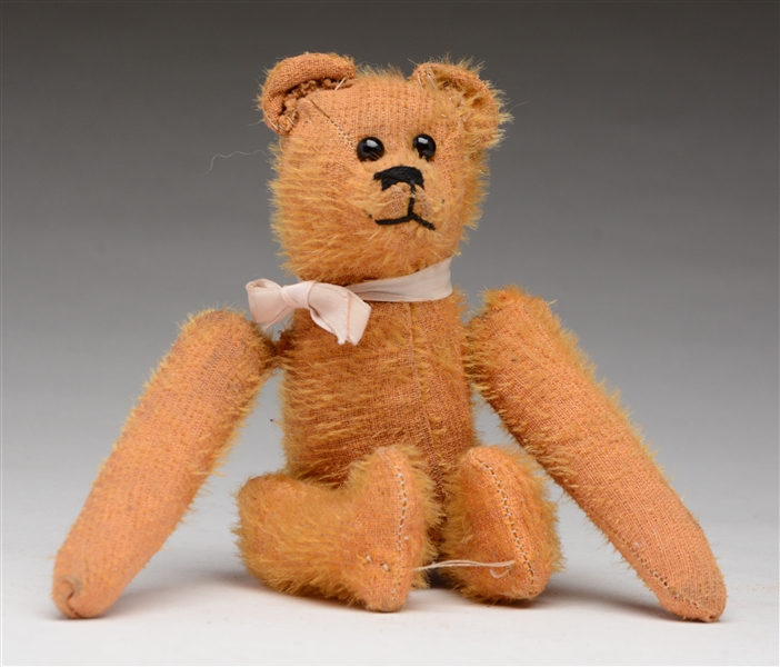 GOLD TEDDY BEAR WITH TUMBLING ACTION.