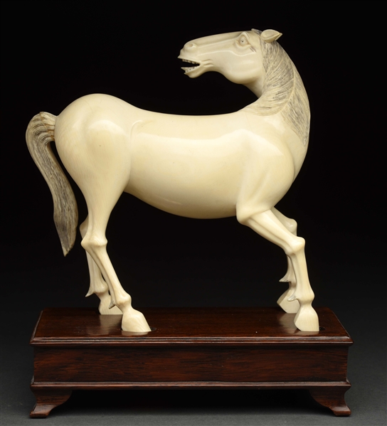 IVORY HORSE CARVED FROM ONE PIECE. 