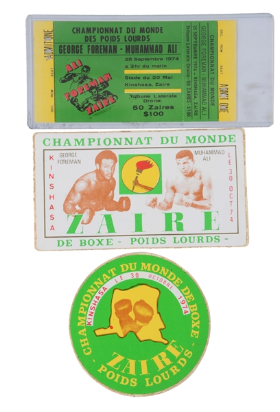 LOT OF 3: MUHAMMAD ALI & GEORGE FOREMAN RUMBLE IN THE JUNGLE TICKET AND SOUVENIRS.
