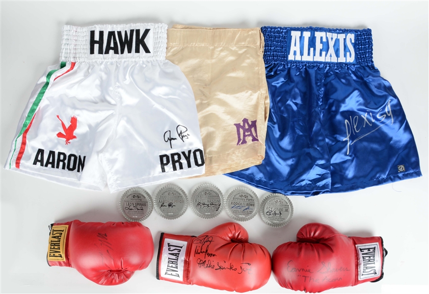 NICE LOT OF SIGNED BOXING GLOVES, TRUNKS AND PAPERWEIGHTS.
